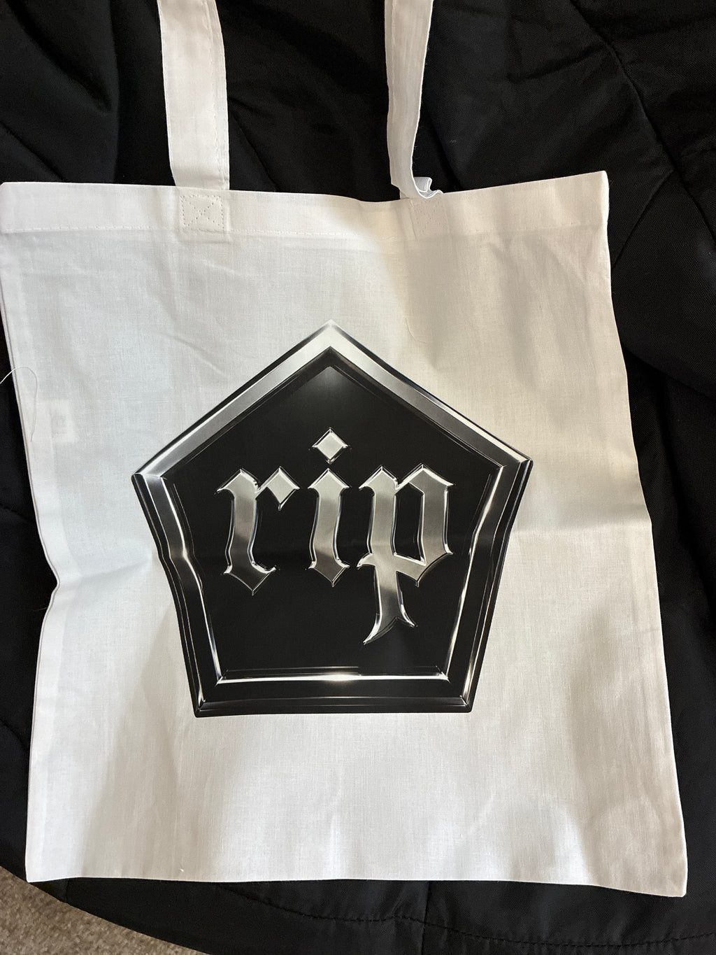 the RIP hive hexagon logo bag